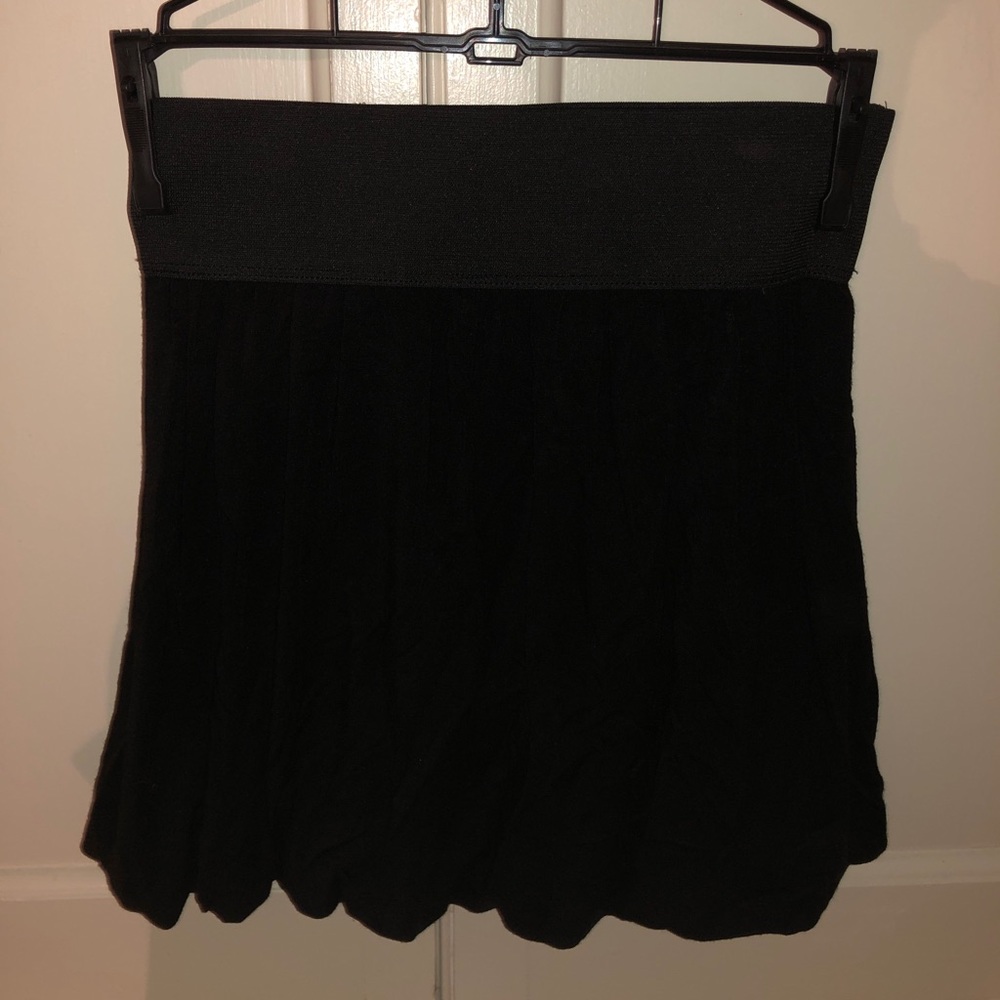 Black skirt with tight waistband- flowy on bottom